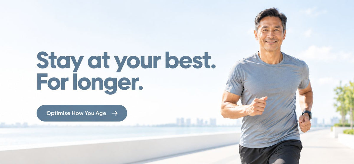 A man in a gray t-shirt and black shorts jogging outdoors on a sunny day, with promotional text on the left reading 'Stay at your best. For longer.